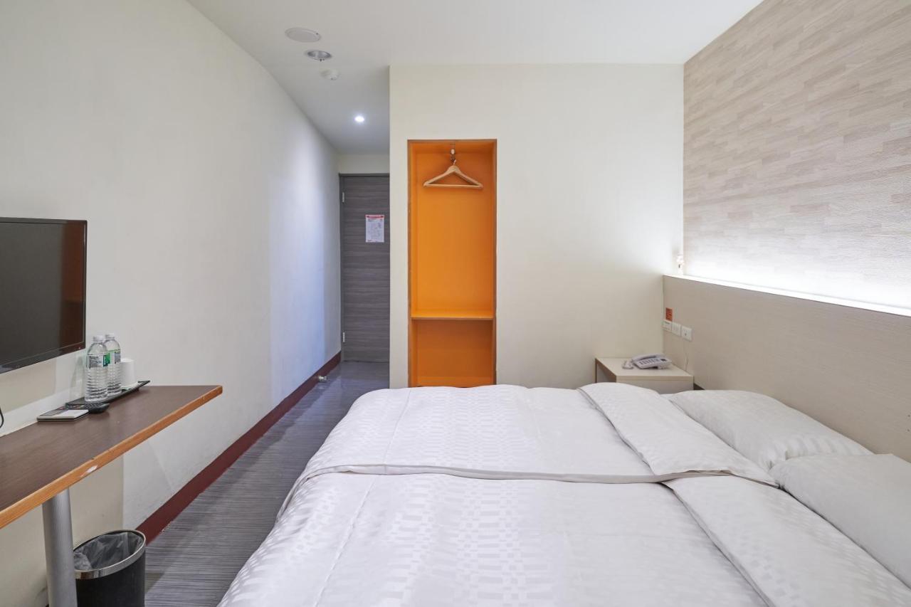 Yung An Business Hotel Dounan Bagian luar foto