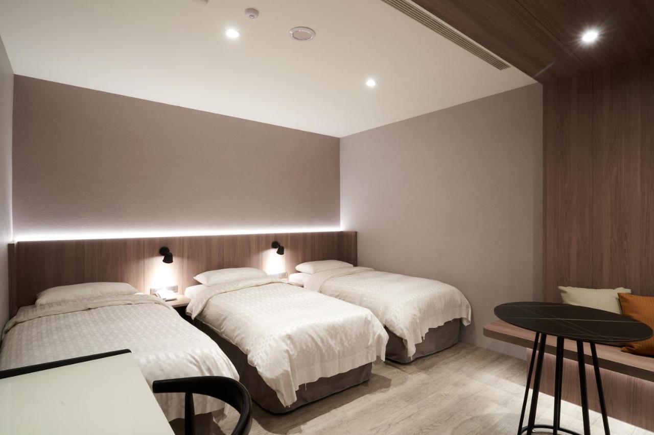 Yung An Business Hotel Dounan Bagian luar foto
