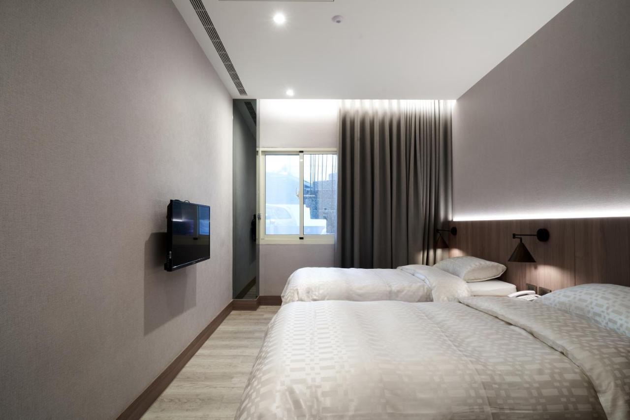 Yung An Business Hotel Dounan Bagian luar foto
