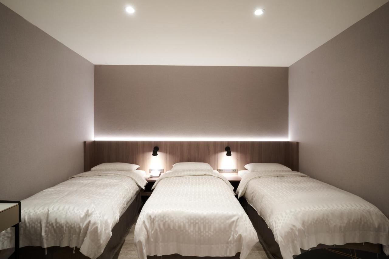Yung An Business Hotel Dounan Bagian luar foto