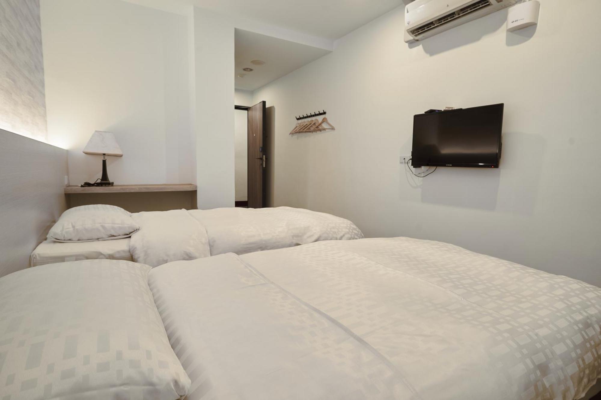 Yung An Business Hotel Dounan Bagian luar foto