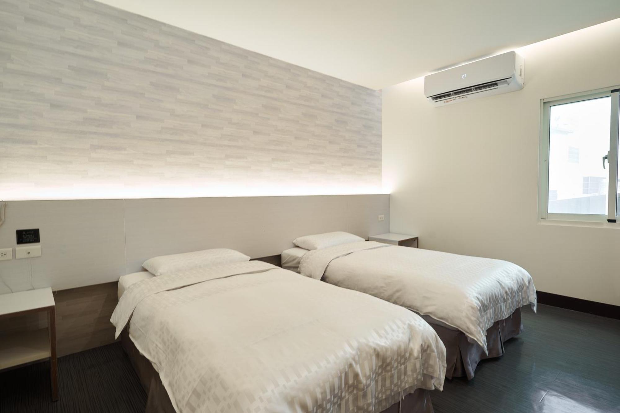 Yung An Business Hotel Dounan Bagian luar foto